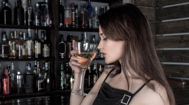 a lady drinking alcohol